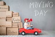 Child moving day in car with boxes