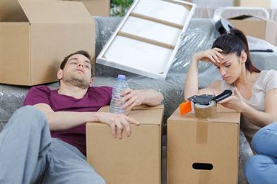 Couple are tired of packing boxes for house clearance