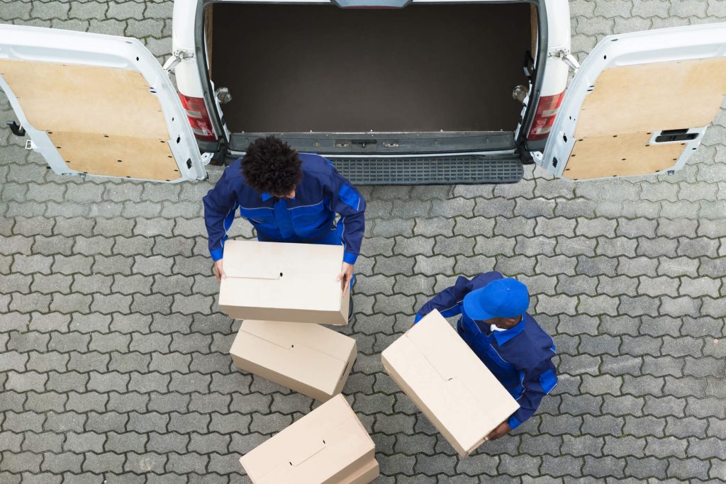 Removal men moving boxes