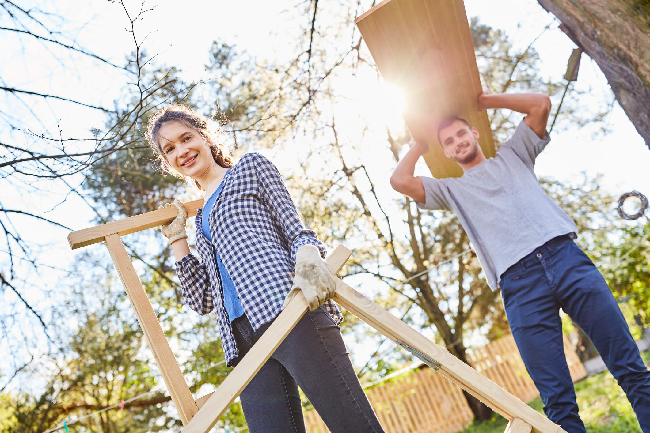 Couple moving garden furniture